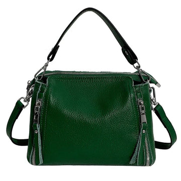 Timeless Zip Carry bag in green premium genuine leather with upscale silver hardware softly structured silhouette with top zipper closure removable top handle and removable and adjustable shoulder strap showcasing upscale utility and elegant design