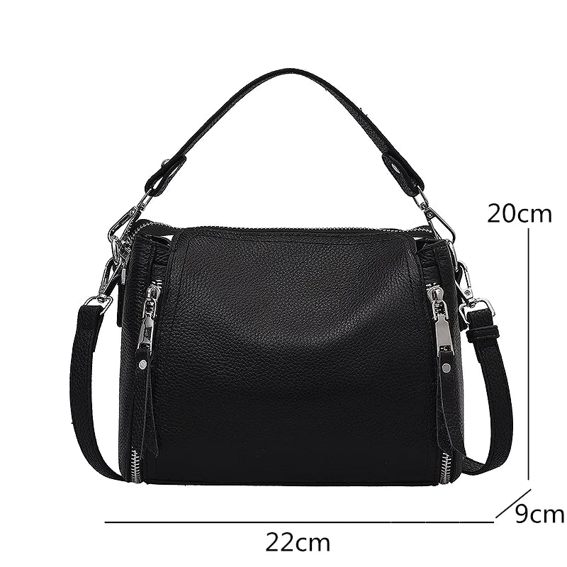 Timeless Zip Carry bag in green premium genuine leather with upscale silver hardware softly structured silhouette with top zipper closure removable top handle and removable and adjustable shoulder strap showcasing upscale utility and elegant design