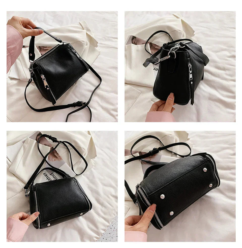 Timeless Zip Carry in black premium genuine leather with upscale silver hardware shown from multiple angles including hand held upright beside sunglasses flat with extended strap and bottom view with metal feet rivets displayed showcasing upscale design and versatile styling