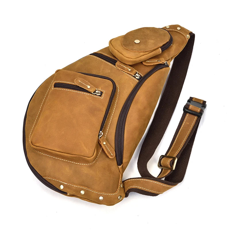 Heritage Nomad Sling men's tan leather crossbody sling bag with zipper pockets and adjustable strap
