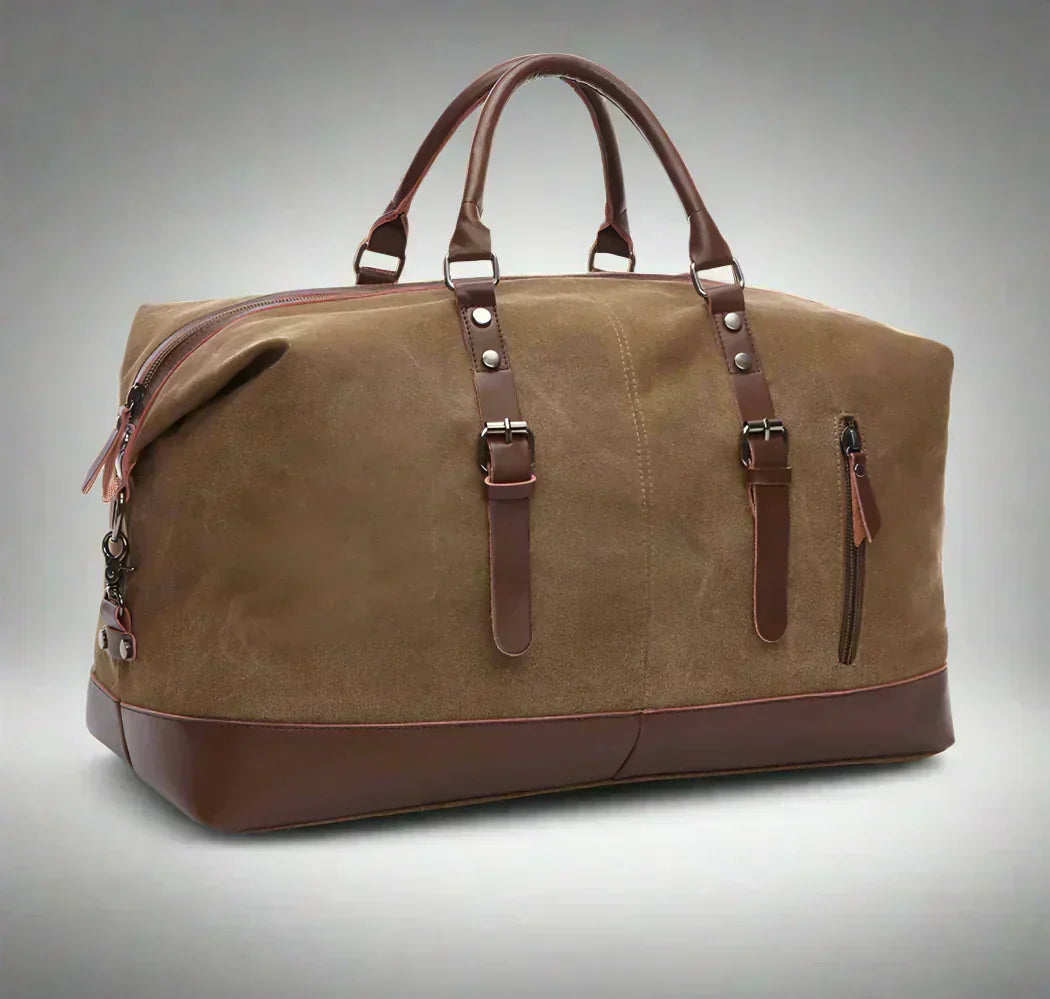 Timeless Travel Carry bag in coffee brown durable canvas with genuine darker brown leather accents structured silhouette dual top handles detachable shoulder strap front buckle straps and reinforced leather base showcasing luxury travel styling upscale craftsmanship premium finish and spacious carry on friendly design