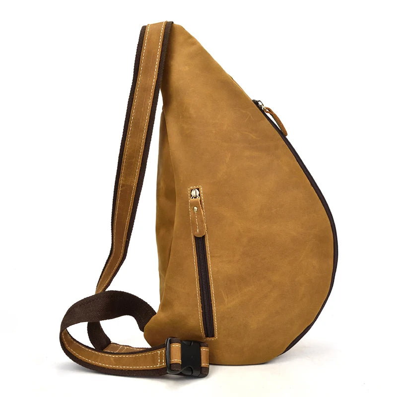 Heritage Nomad Sling men's crossbody sling bag in tan leather with front zipper pocket and adjustable strap