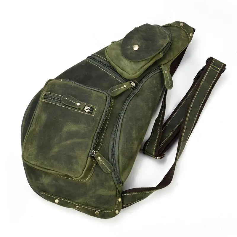 Heritage Nomad Sling men's crossbody sling bag in green leather with multiple zip pockets and coin pouch