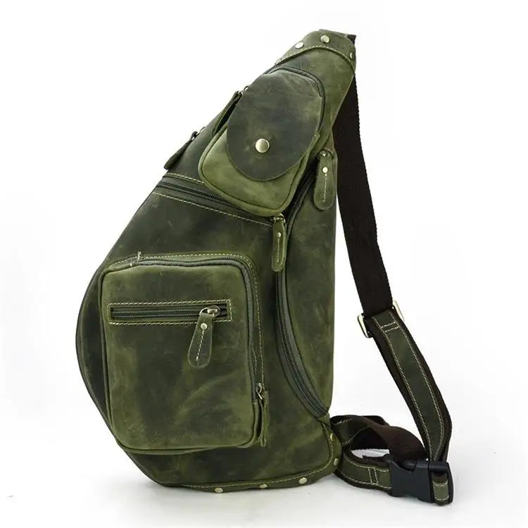 Heritage Nomad Sling men's crossbody sling bag in green leather with multiple zippered pockets, coin pouch and adjustable strap