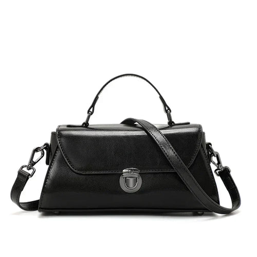 Metro Fold Carry black womens leather crossbody bag silver hasp buckle compact structured shoulder handbag