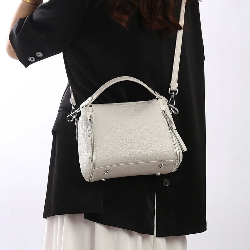 Timeless Zip Carry women's crossbody bag in textured white genuine leather with top handle