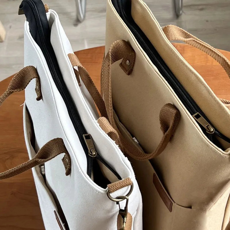 Beige and khaki Timeless Canvas Carry womens canvas totes top angled view with zipper closed premium canvas commuter tote womens work bag