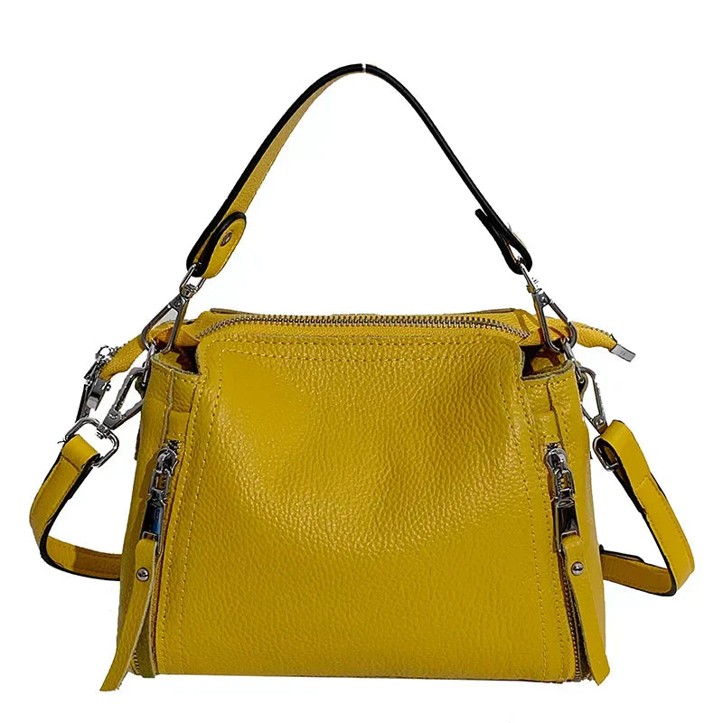 Timeless Zip Carry  bag in vibrant yellow premium genuine leather with upscale silver hardware softly structured silhouette with top zipper closure removable top handle and adjustable and removable shoulder strap showcasing bold elegance and luxe functionality