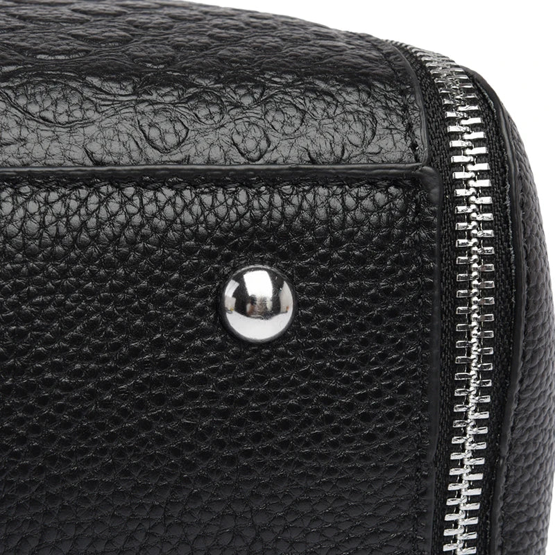 Timeless Zip Carry women's black textured leather bag corner with metal feet rivet and zipper detail