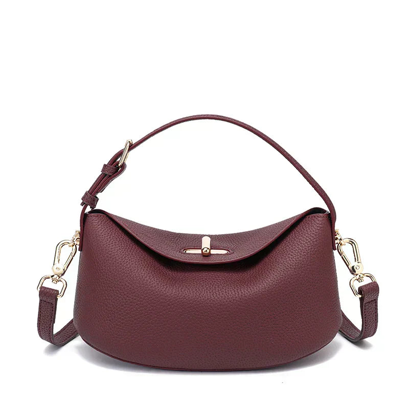 Timeless Arc Tote in taupe real leather angled side view luxury tote