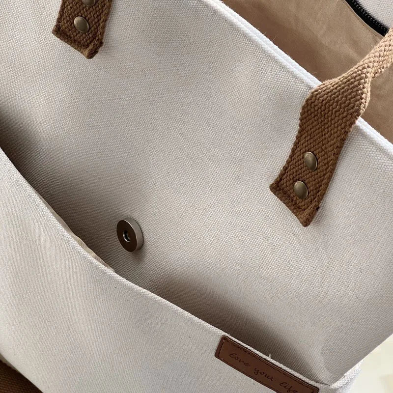 Beige Timeless Canvas Carry womens canvas tote with brown leather handles front snap pocket womens commuter tote womens work tote canvas shoulder bag