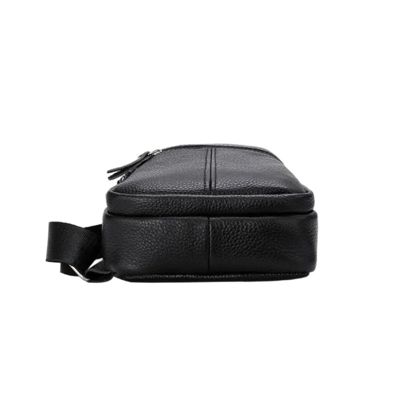 Urban Leather Sling men’s black leather crossbody bag with zip closure and adjustable strap with silver hardware