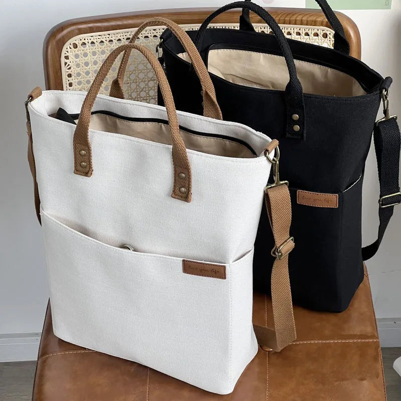 Timeless Canvas Carry black premium canvas tote with leather handles spacious multi pocket design removable adjustable crossbody strap womens canvas work tote