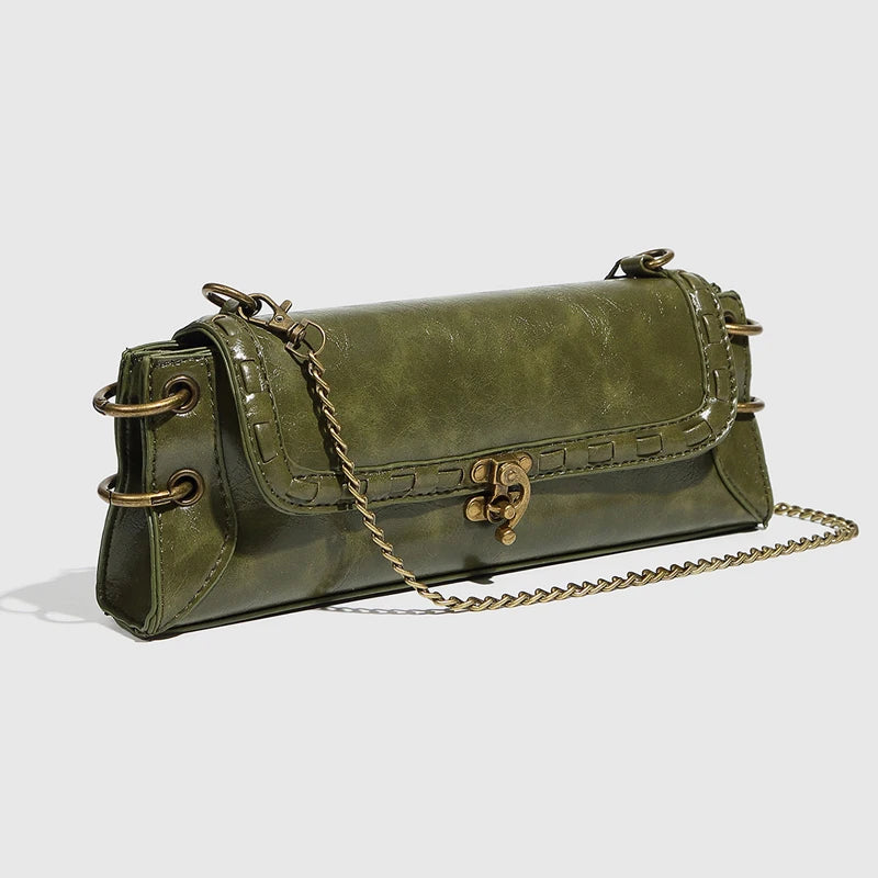 Luxe Chain Carry women’s green vegan leather clutch bag with chain strap and brass hardware