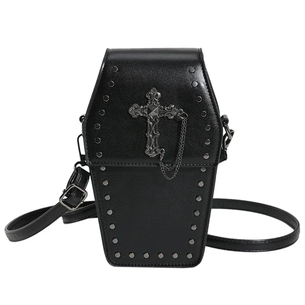 Midnight Edge Crossbody bag in black luxury vegan leather shaped like a coffin with gothic cross detail and metal stud accents featuring flap closure and adjustable strap showcasing bold unconventional design and durable premium construction for upscale standout everyday styling