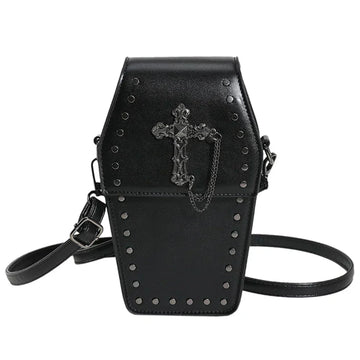 Midnight Edge Crossbody bag in black luxury vegan leather shaped like a coffin with gothic cross detail and metal stud accents featuring flap closure and adjustable strap showcasing bold unconventional design and durable premium construction for upscale standout everyday styling