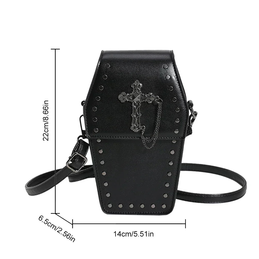 Midnight Edge Crossbody bag in luxury black vegan leather shaped like a coffin with silver cross embellishment and metal stud accents shown with labeled dimensions showcasing bold unconventional design and durable premium construction for upscale gothic inspired styling