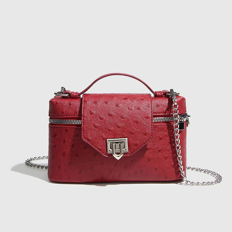 Timeless Petite Luxe women’s red faux leather crossbody bag with chain strap and textured finish