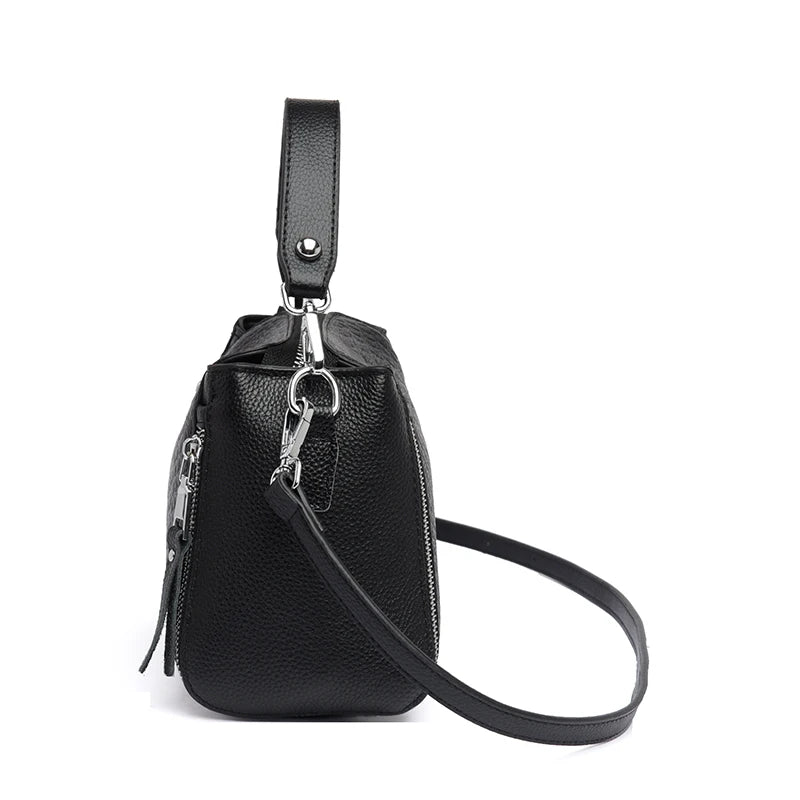 Timeless Zip Carry women’s black leather crossbody bag with grain texture and silver hardware