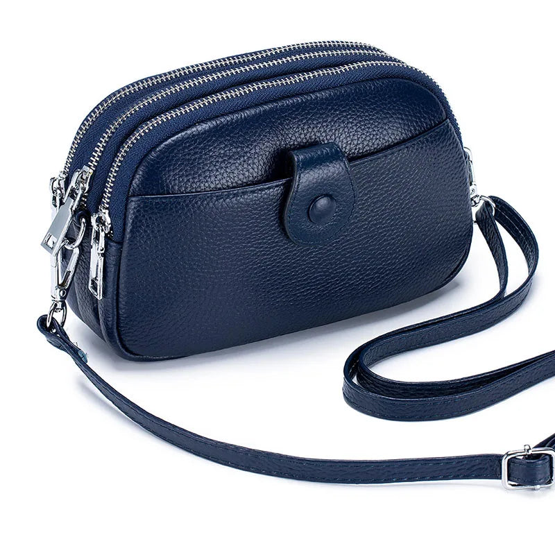 Signature Convertible Carry women’s crossbody bag, navy textured genuine leather, adjustable strap, 3 zip pockets, front snap pocket and silver hardware