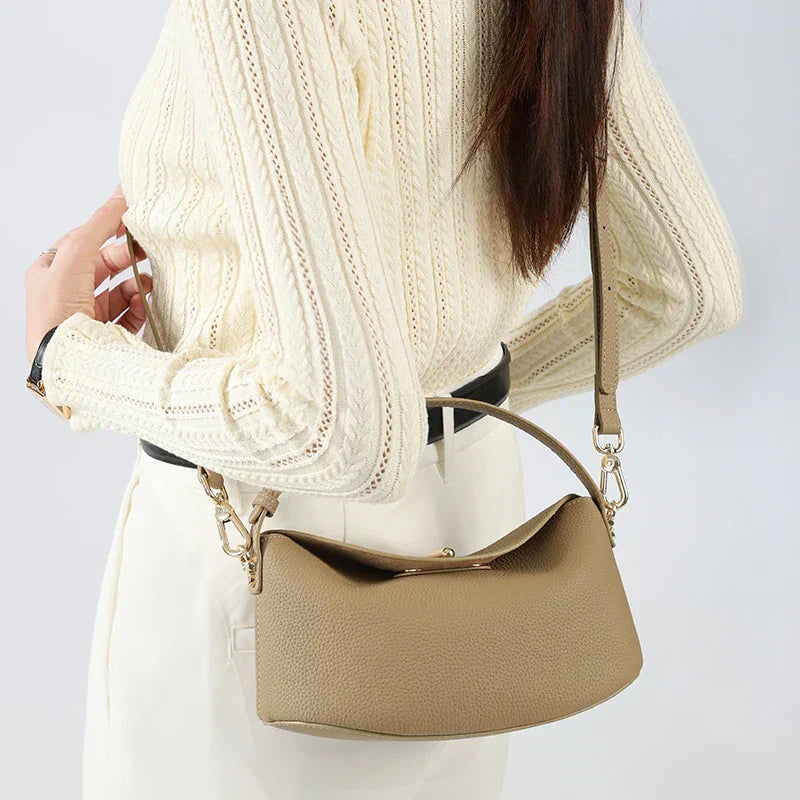 Timeless Arc Tote in taupe real leather worn crossbody style