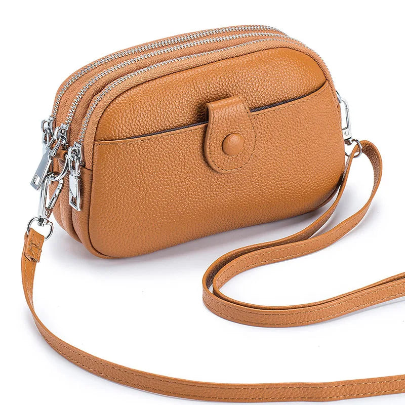 Signature Convertible Carry women’s crossbody bag in brown pebbled genuine leather with 3 zip pockets, long strap with silver hardware and front snap pocket