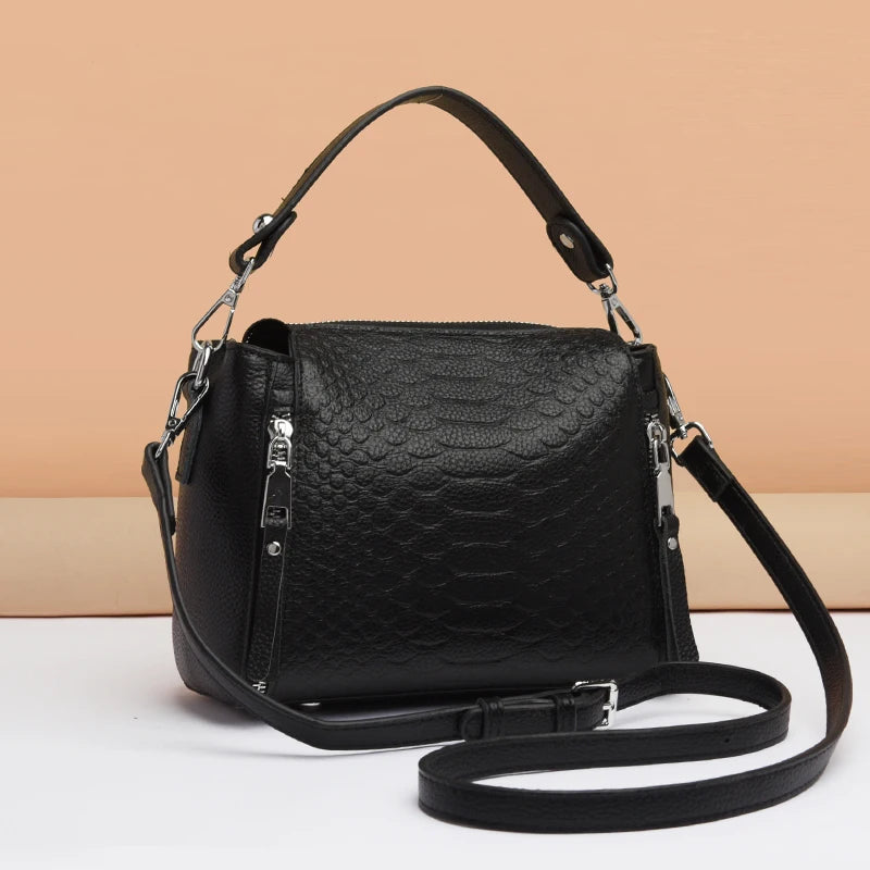 Timeless Zip Carry women’s black textured shoulder bag with adjustable crossbody strap, leather finish