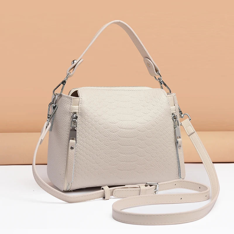 Timeless Zip Carry women's crossbody bag in textured cream genuine leather with top handle and adjustable strap