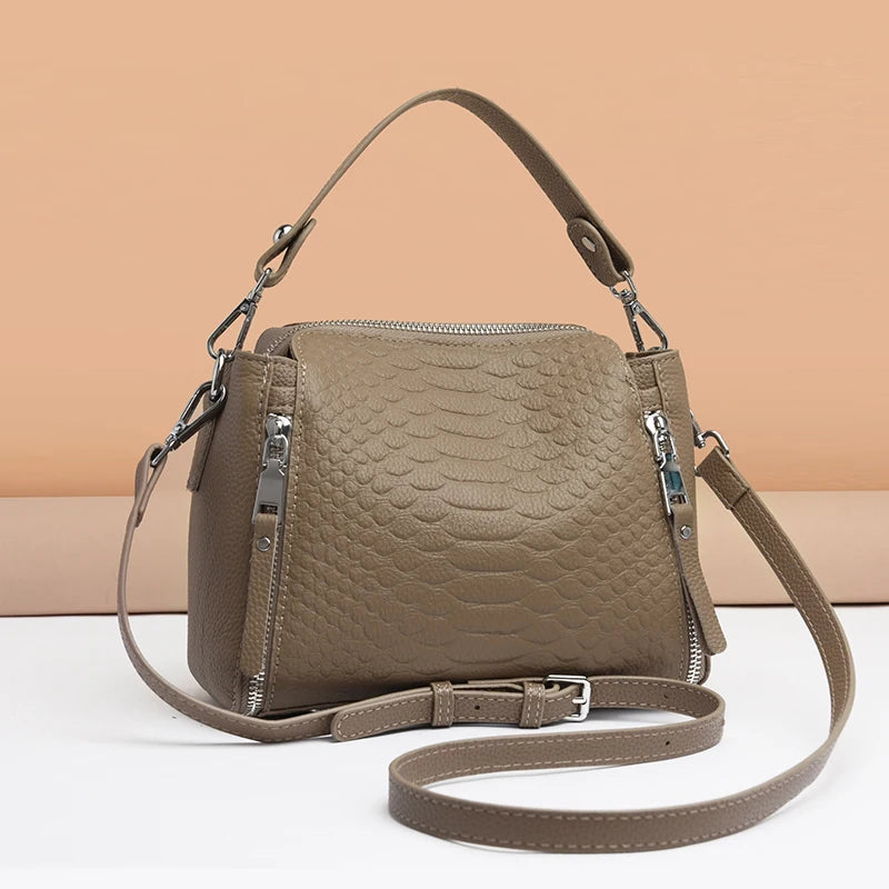 Timeless Zip Carry women’s taupe genuine leather crossbody bag with textured pattern and top handle