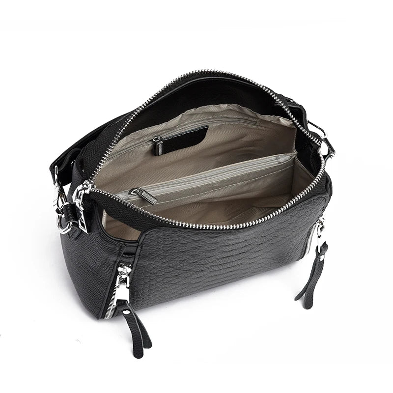 Timeless Zip Carry women's black genuine leather shoulder bag with top zipper and spacious interior compartments