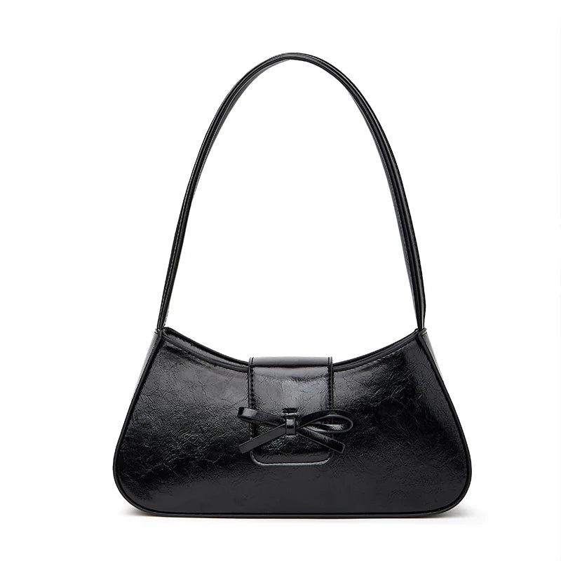 Timeless Bow Carry women's black vegan leather shoulder bag with bow detail and glossy finish