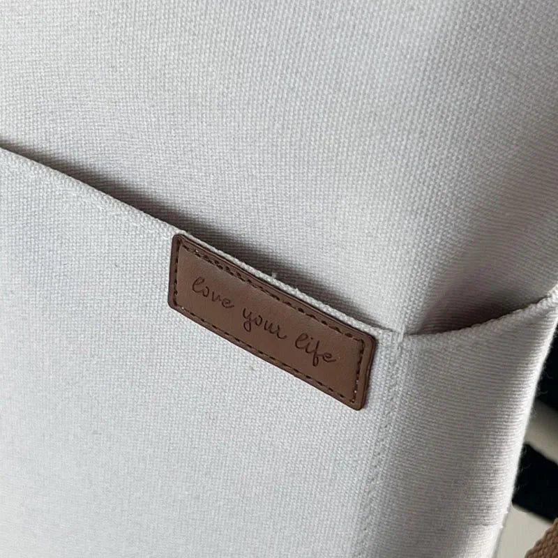 Timeless Canvas Carry beige womens canvas tote with leather handles front slip pocket side slip pocket premium canvas label detail