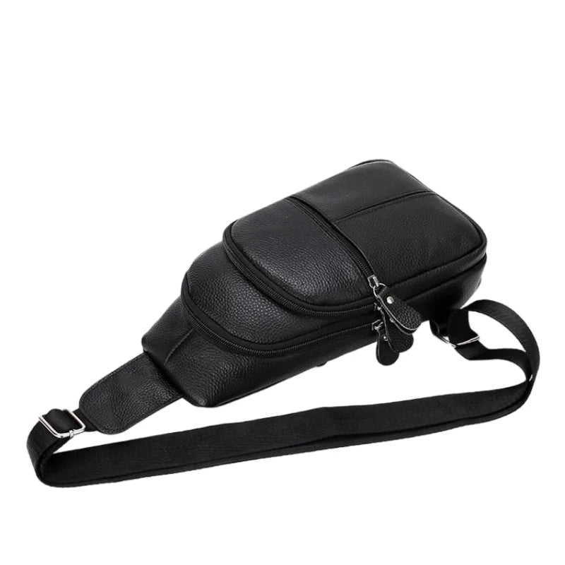 Urban Leather Sling men's black leather crossbody sling bag with adjustable strap and zippered pockets with silver hardware