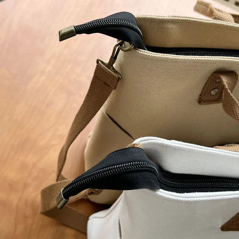 Beige and khaki Timeless Canvas Carry womens canvas totes with black zippers and detachable adjustable crossbody straps womens commuter tote bags