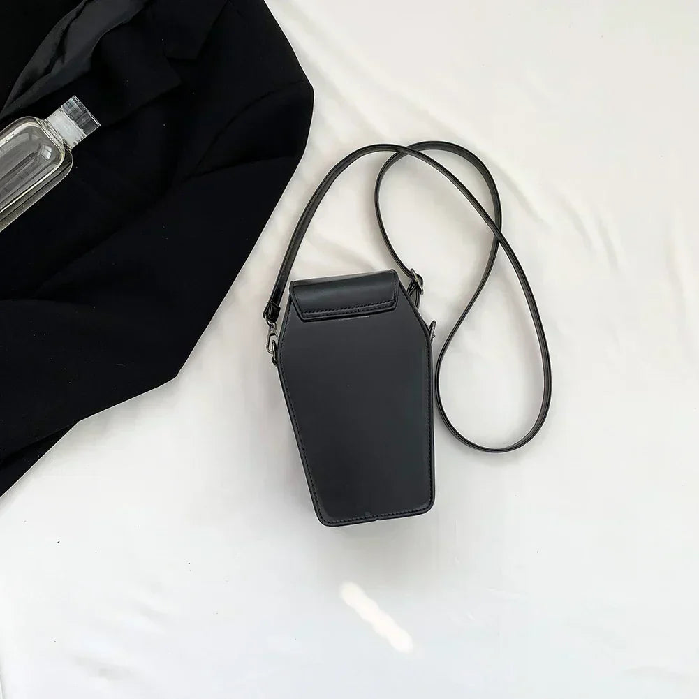 Midnight Edge Crossbody bag in luxury black vegan leather back view with structured silhouette and long strap shown featuring zipper closure and metal hardware showcasing bold edgy styling and durable premium construction for upscale everyday carry
