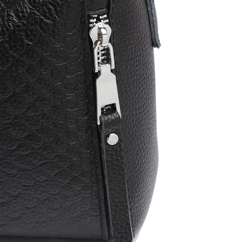 Timeless Zip Carry women's black textured leather bag side zipper detail