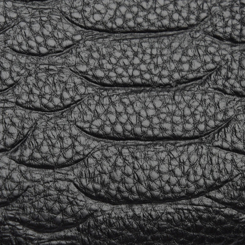 Timeless Zip Carry material detail, black textured genuine leather surface