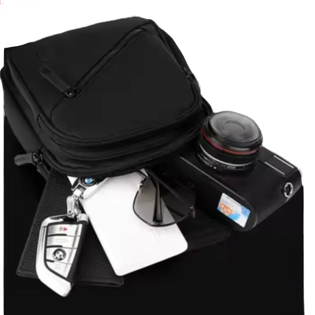 Active Axis Crossbody durable spacious design with camera sunglasses phone and keys displayed to show upscale storage capacity
