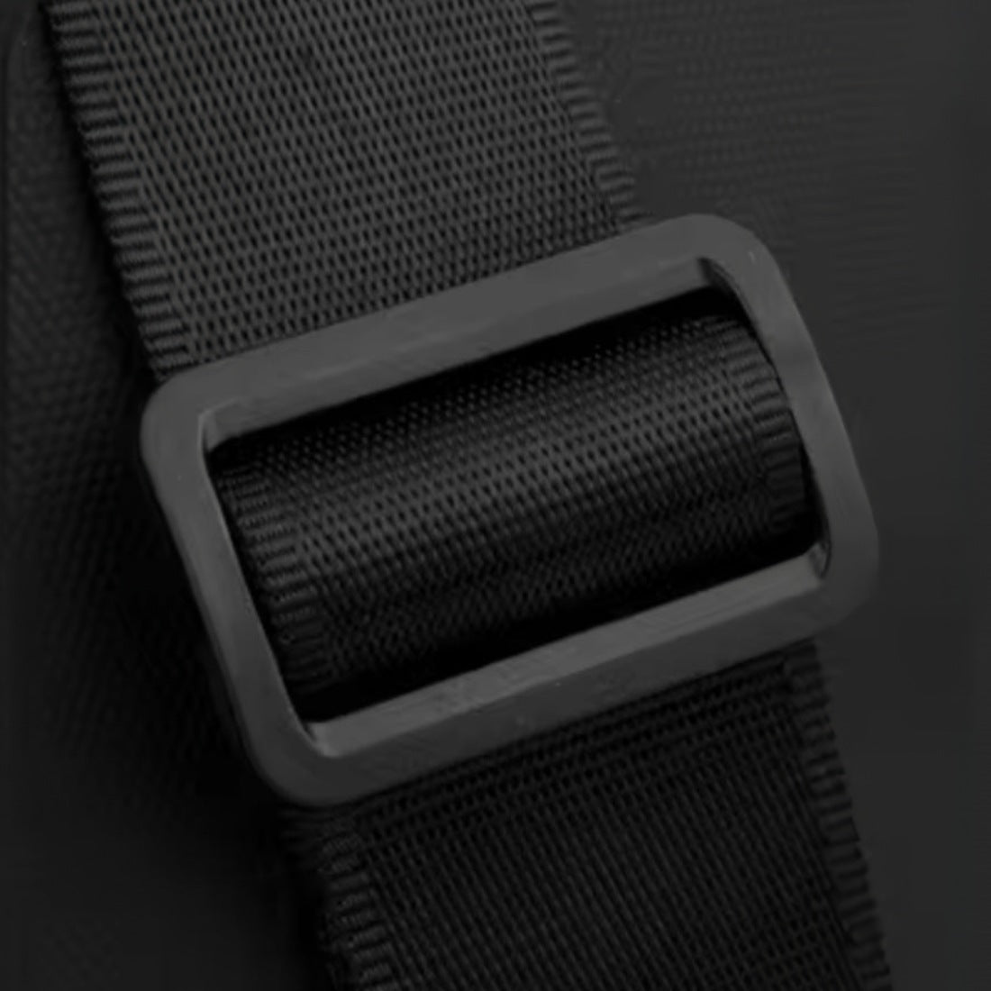 Active Axis Crossbody adjustable strap close up, featuring durable nylon material and upscale reinforced buckle for secure and comfortable wear