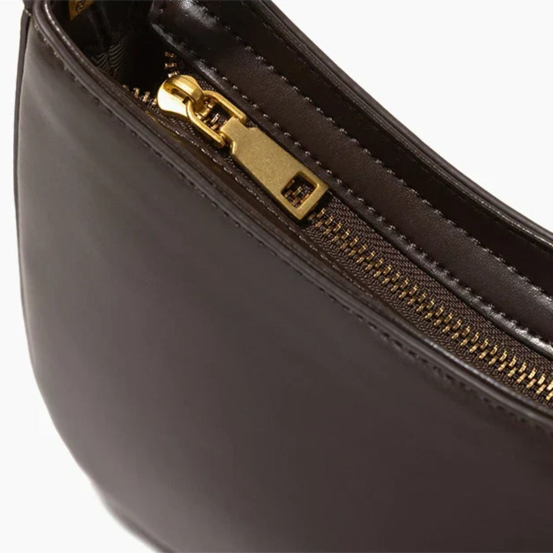Timeless Arc Carry luxury genuine leather close up zipper and gold hardware detail