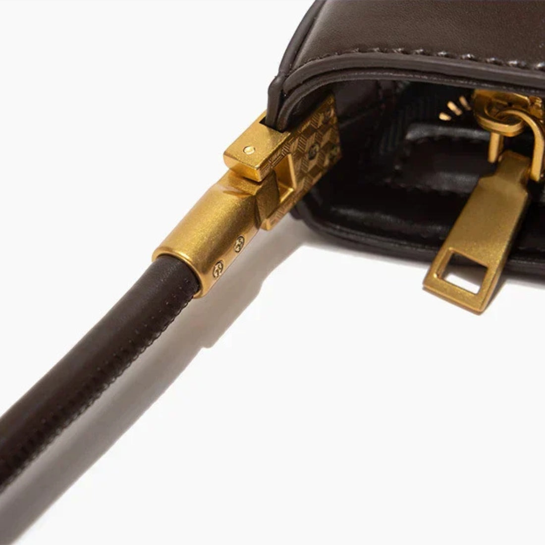 Timeless Arc Carry premium upscale brown leather handbag with gold hardware close up
