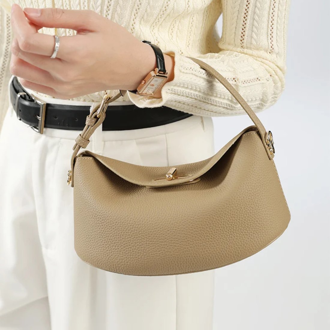 Timeless Arc Tote handheld in genuine luxury taupe leather styled with outfit