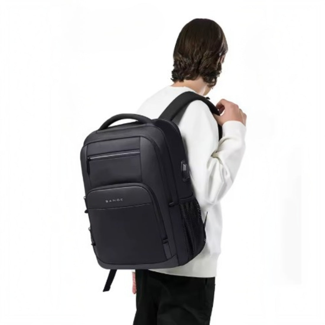 BANGE Atlas Tech Pack in black waterproof oxford fabric worn on back featuring padded shoulder straps and sleek silhouette displayed showcasing ergonomic comfort and durable modern tech ready styling