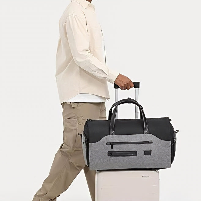waterproof durable spacious axis travel companion mens duffle bag on top of suitcase with a model 