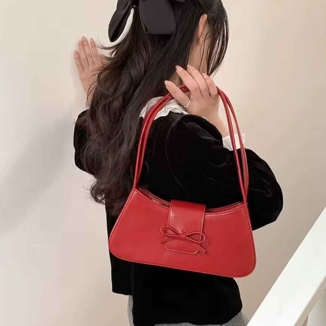Timeless Bow Carry red luxury vegan leather handbag styled with outfit premium feminine bow accent