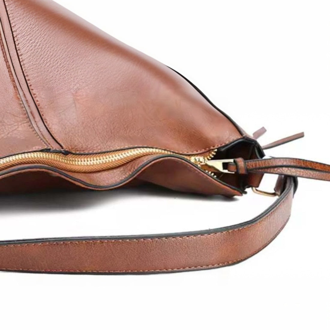 Classic Carry Hobo in brown premium vegan leather partially unzipped to reveal interior lining and zipper mechanism with visible strap attachment showcasing elegant soft texture upscale craftsmanship and secure everyday luxury design