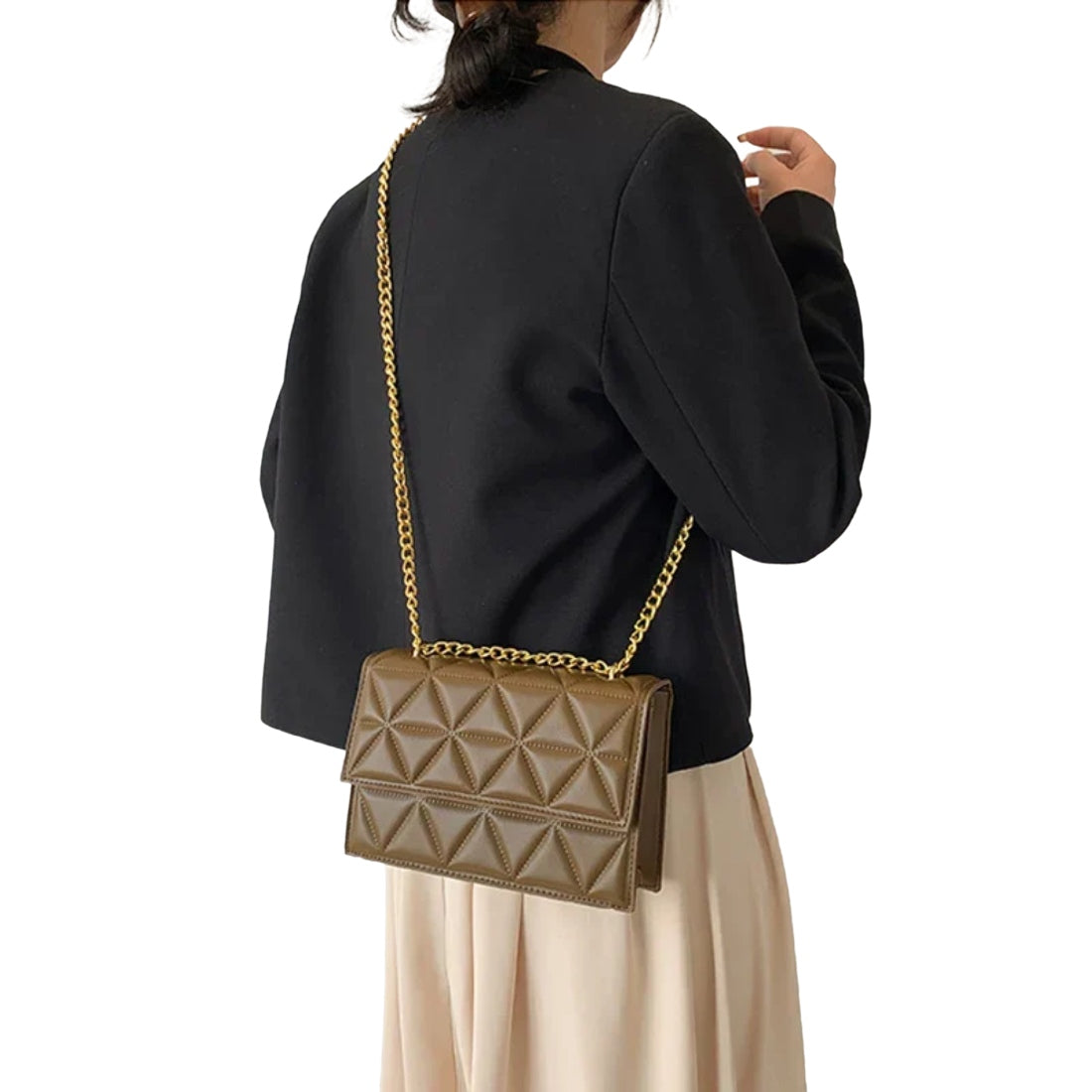 Timeless Chain Crossbody upscale bag in brown vegan leather with geometric quilted texture gold chain strap and flap closure worn by model showcasing warm classic styling polished premium finish and compact everyday elegance