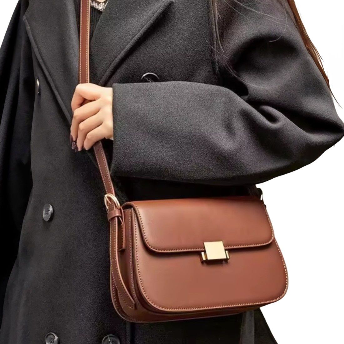 Timeless Charm Satchel in caramel genuine kitt cross grain leather with structured rectangular silhouette flap front design gold accent hasp closure and long shoulder strap worn crossbody by model showcasing luxury styling upscale craftsmanship premium finish and compact everyday sophistication