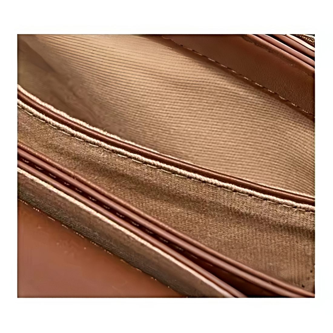 Timeless Charm Satchel close up of reinforced stitching on caramel genuine kitt cross grain leather satchel showing parallel seam lines in contrasting thread showcasing luxury detailing upscale craftsmanship and premium structural integrity