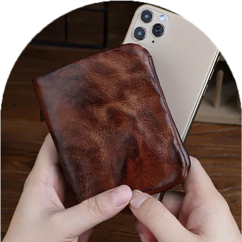 Homepage Creased Heritage Compact Fold luxury wallet in brown leather premium compact design held with phone